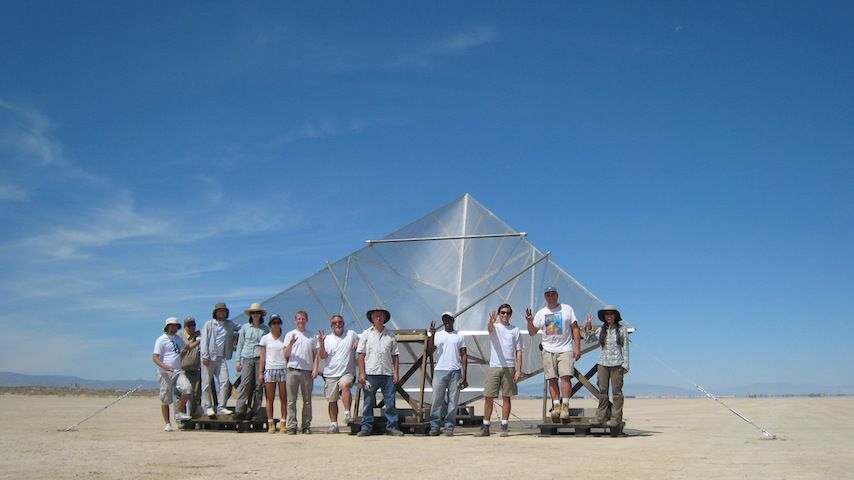 Large 4.8-meter corner reflector towers over the group of a dozen people who built it